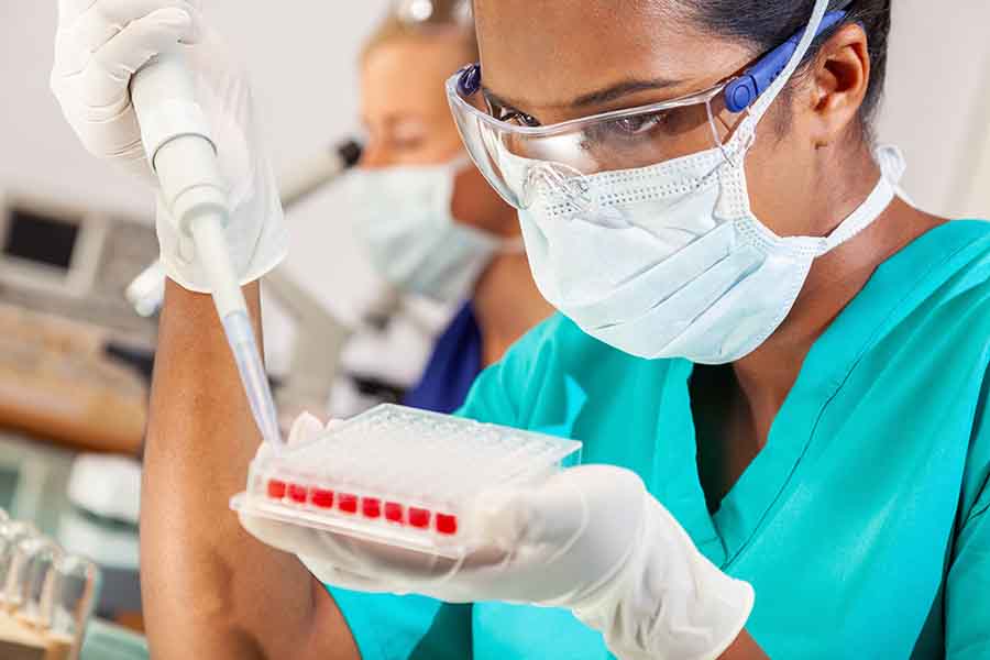 Woman in STEM career working with blood samples in laboratory